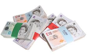 wads of UK banknotes