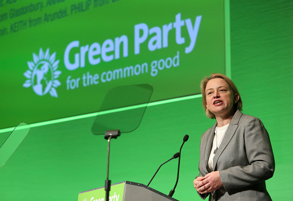 Natalie Bennett in front of Green Party backdrop